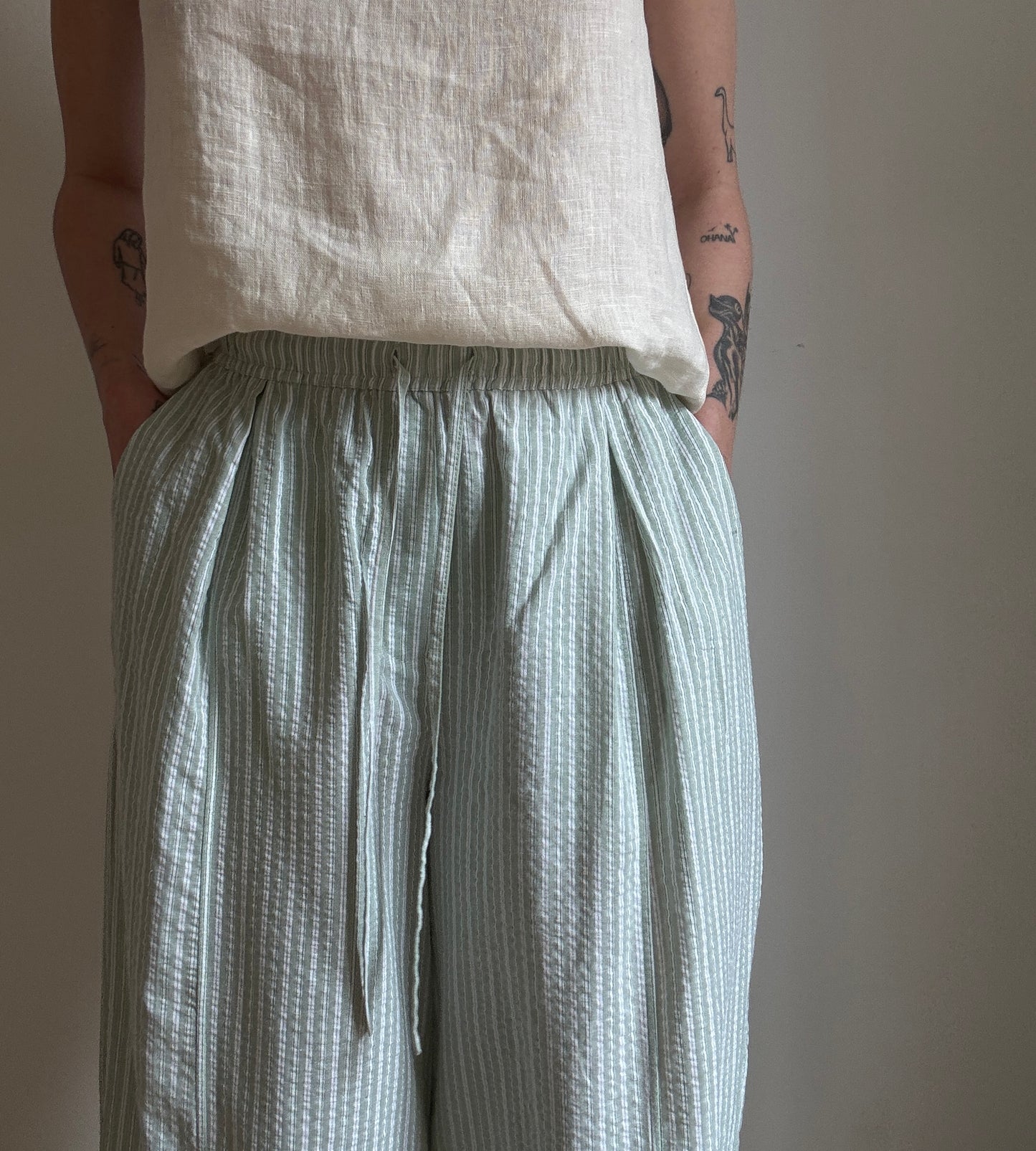 Green cotton trousers with milk stripes