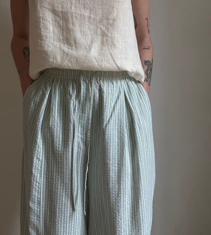 Green cotton trousers with milk stripes
