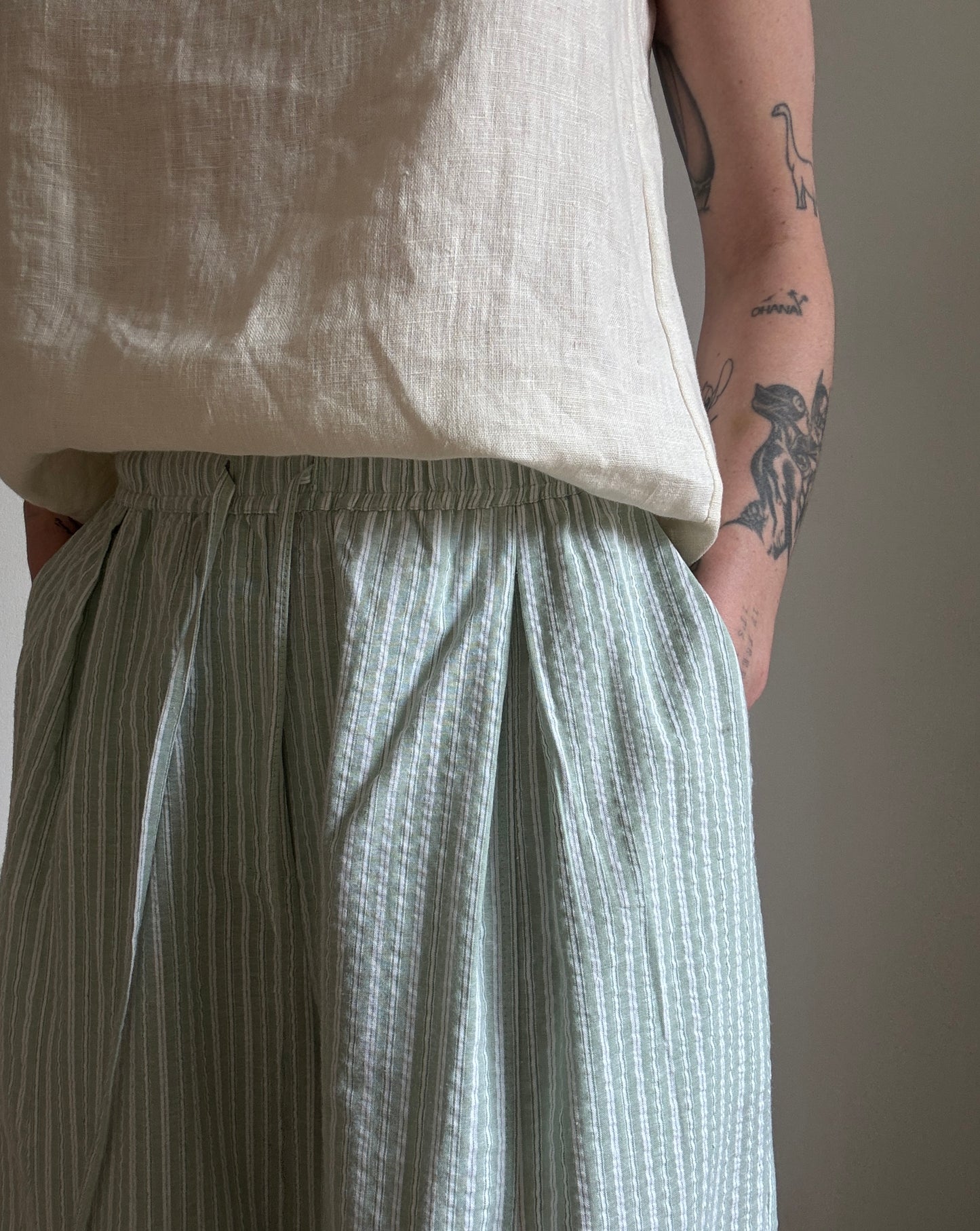 Green cotton trousers with milk stripes