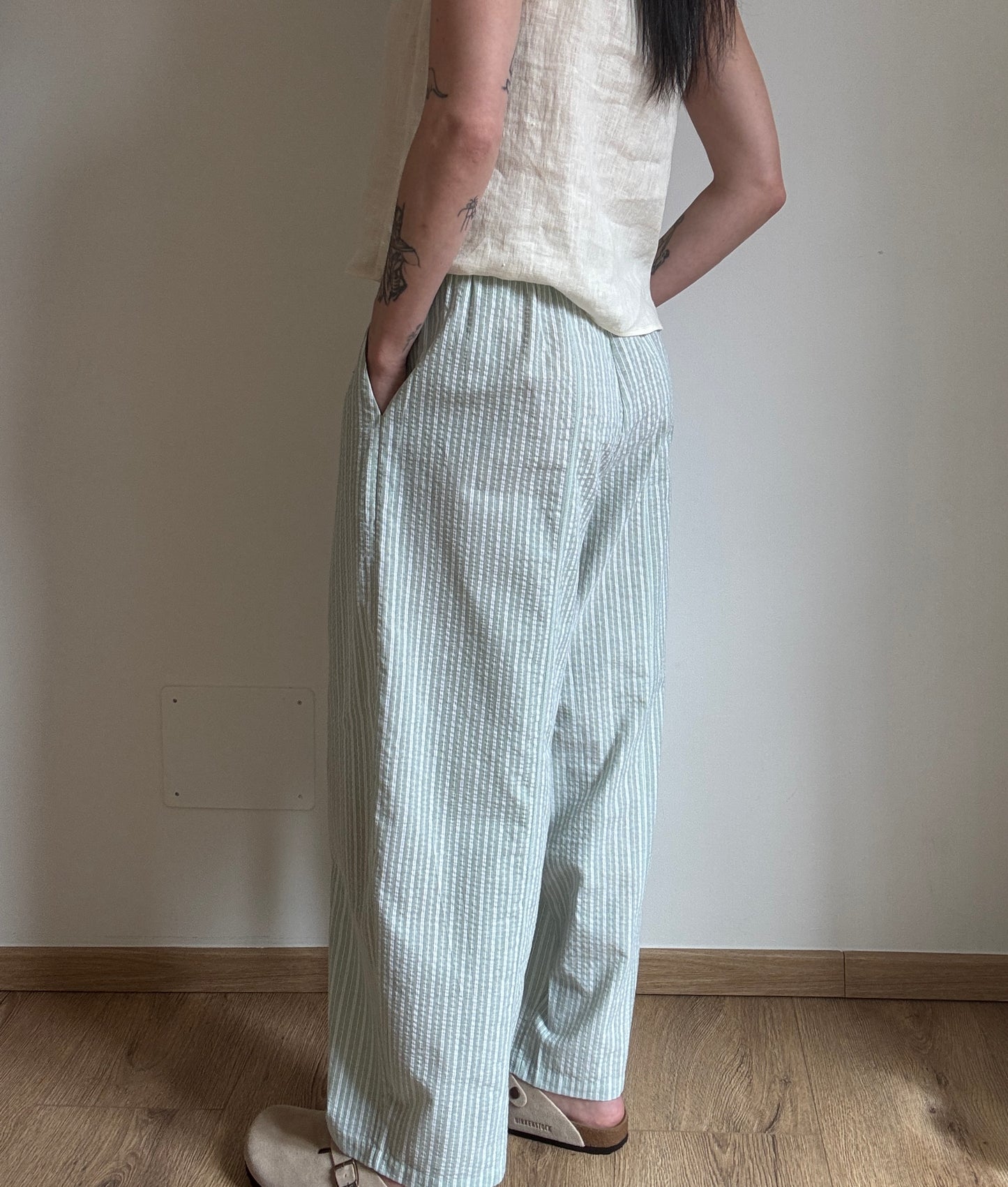 Green cotton trousers with milk stripes
