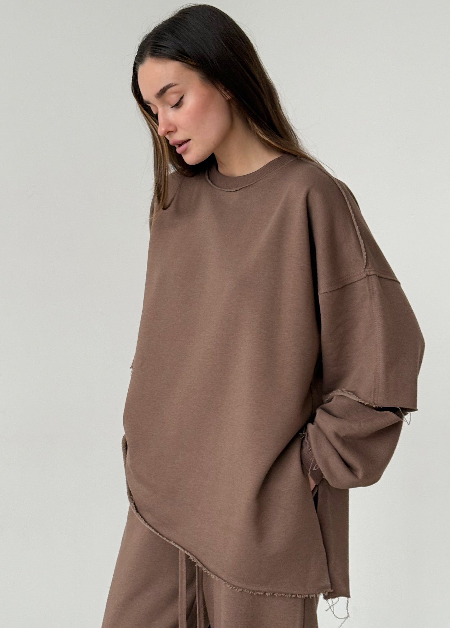 Brown cotton sweatshirt with a ripped elbow