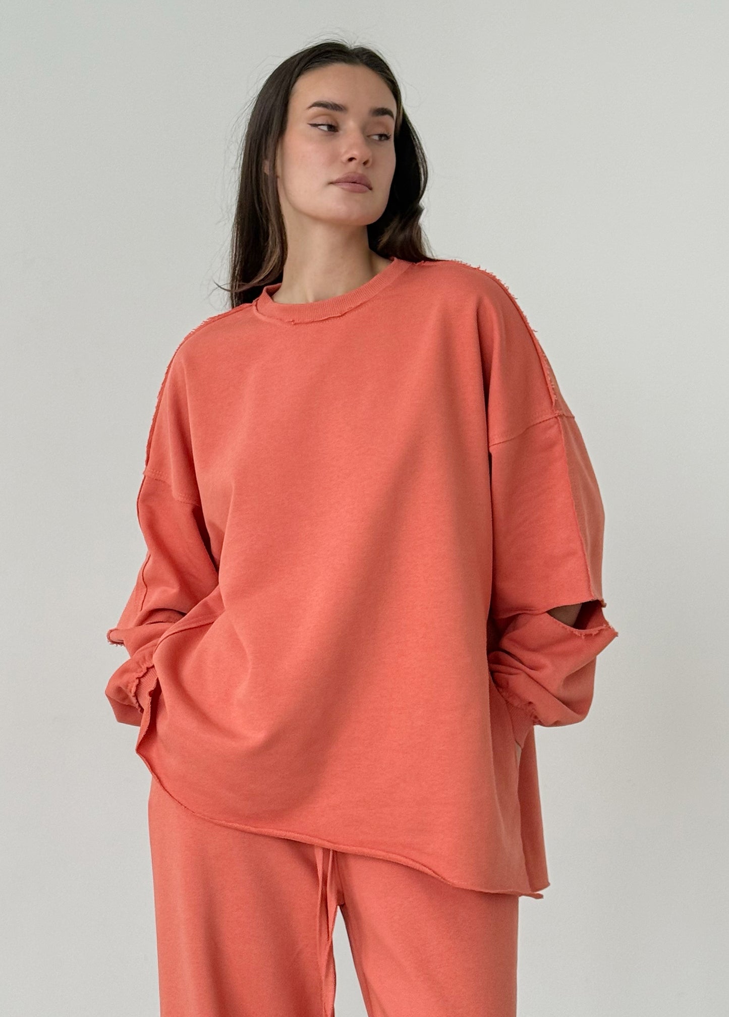 Apricot cotton sweatshirt with a ripped elbow
