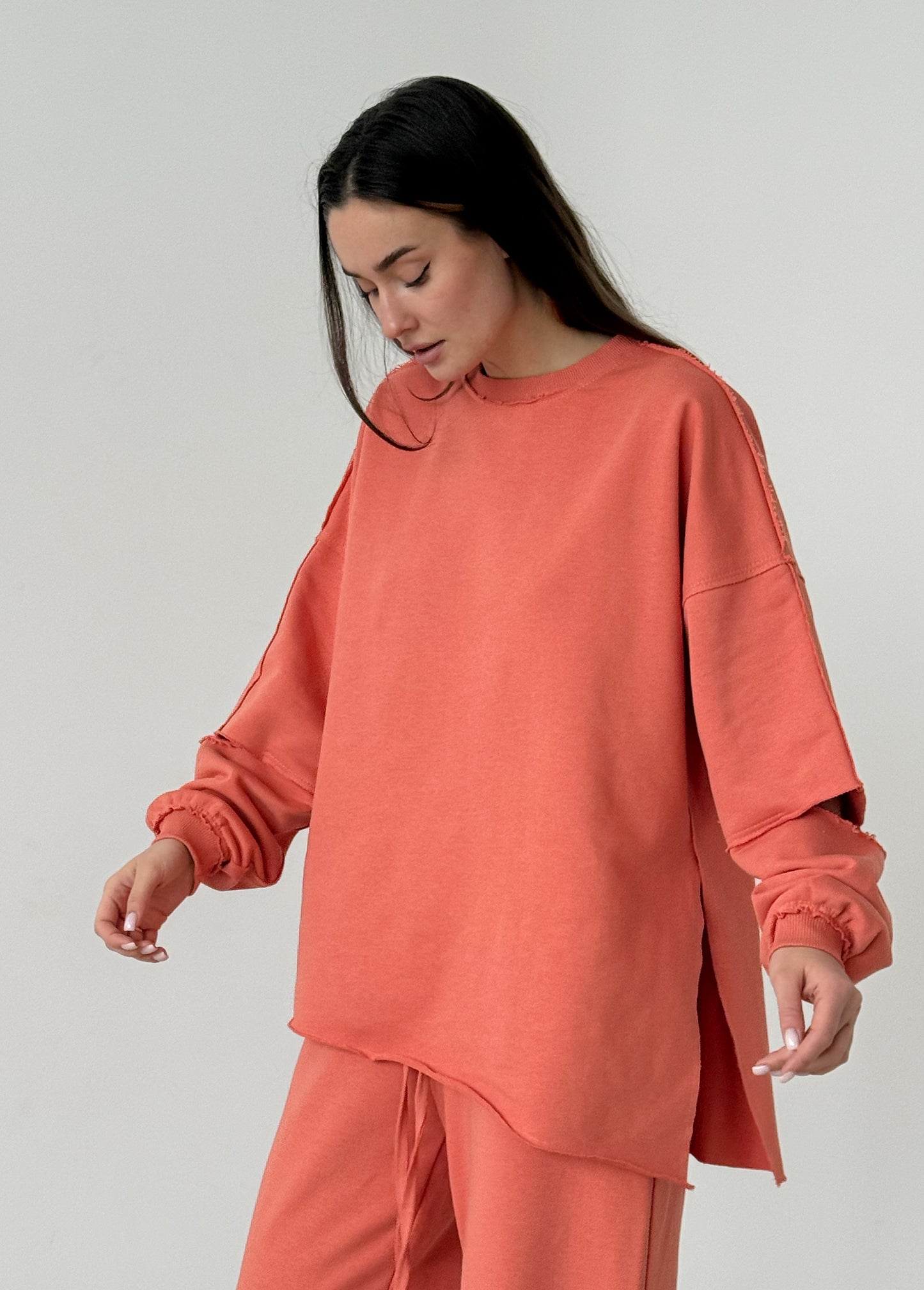 Apricot cotton sweatshirt with a ripped elbow