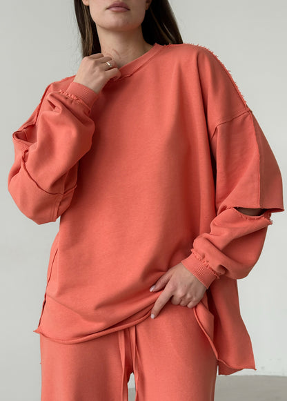 Apricot cotton sweatshirt with a ripped elbow
