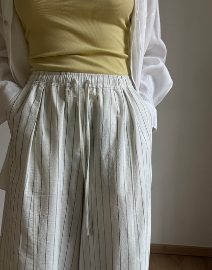 Milk cotton trousers with black stripes