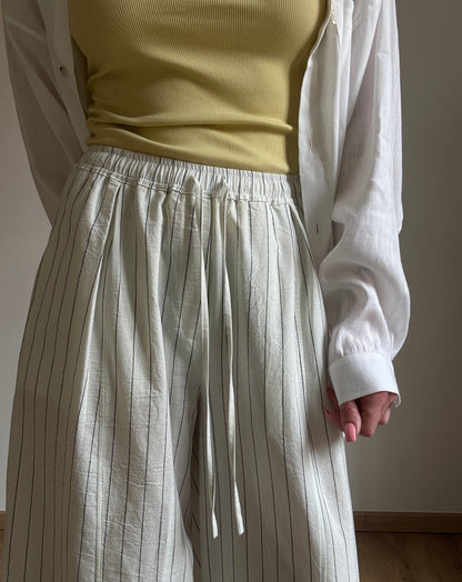 Milk cotton trousers with black stripes