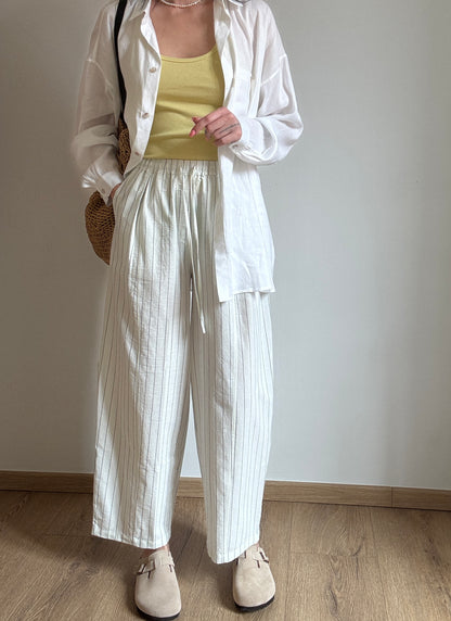 Milk cotton trousers with black stripes