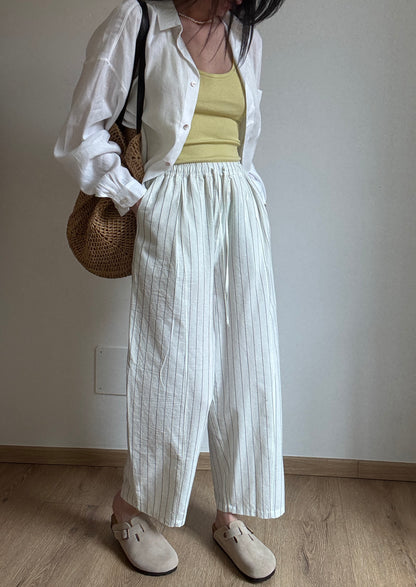 Milk cotton trousers with black stripes