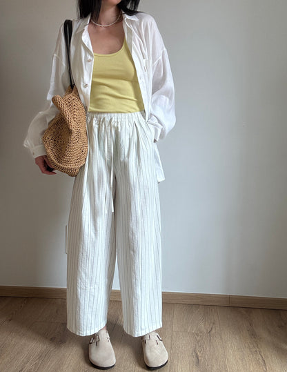 Milk cotton trousers with black stripes