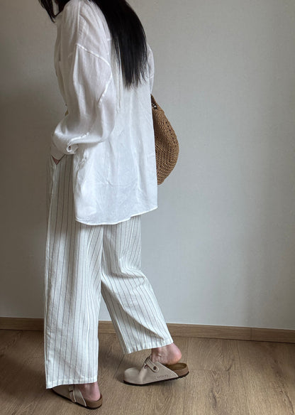 Milk cotton trousers with black stripes