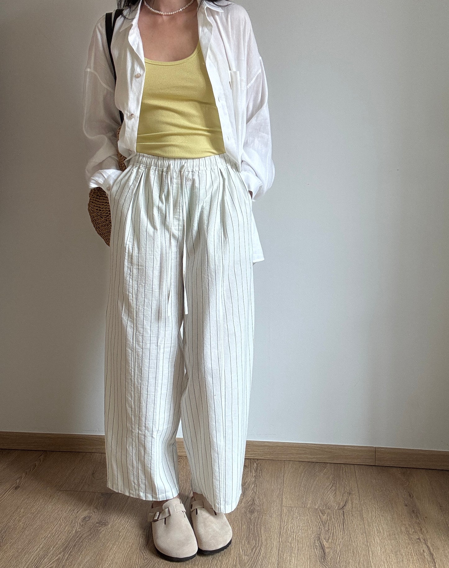 Milk cotton trousers with black stripes