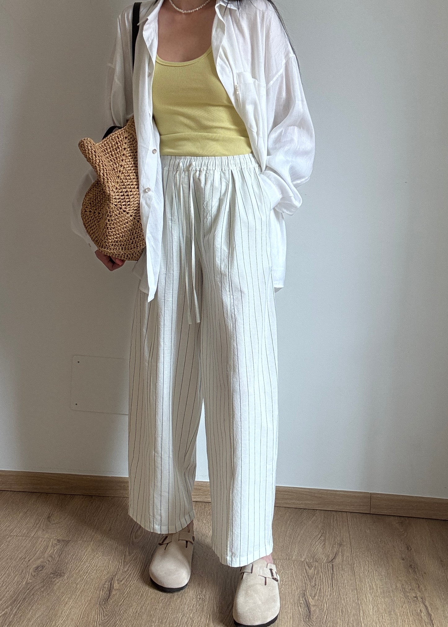 Milk cotton trousers with black stripes