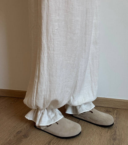 Natural trousers with ruffle detail