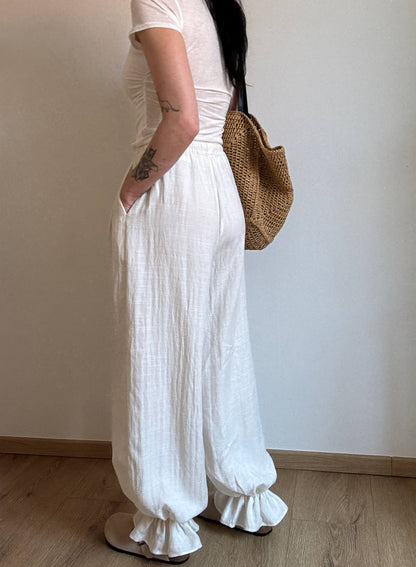 Natural trousers with ruffle detail