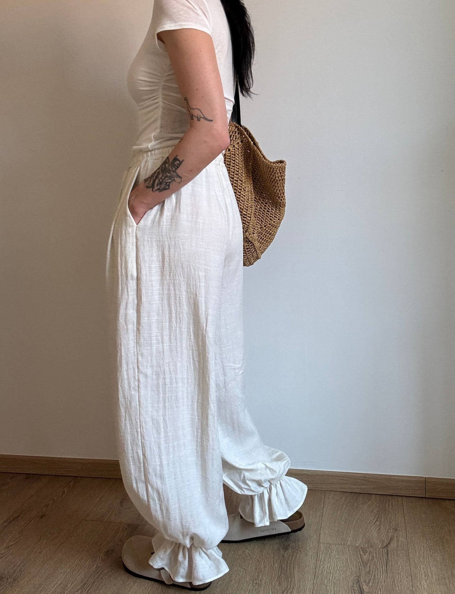 Natural trousers with ruffle detail