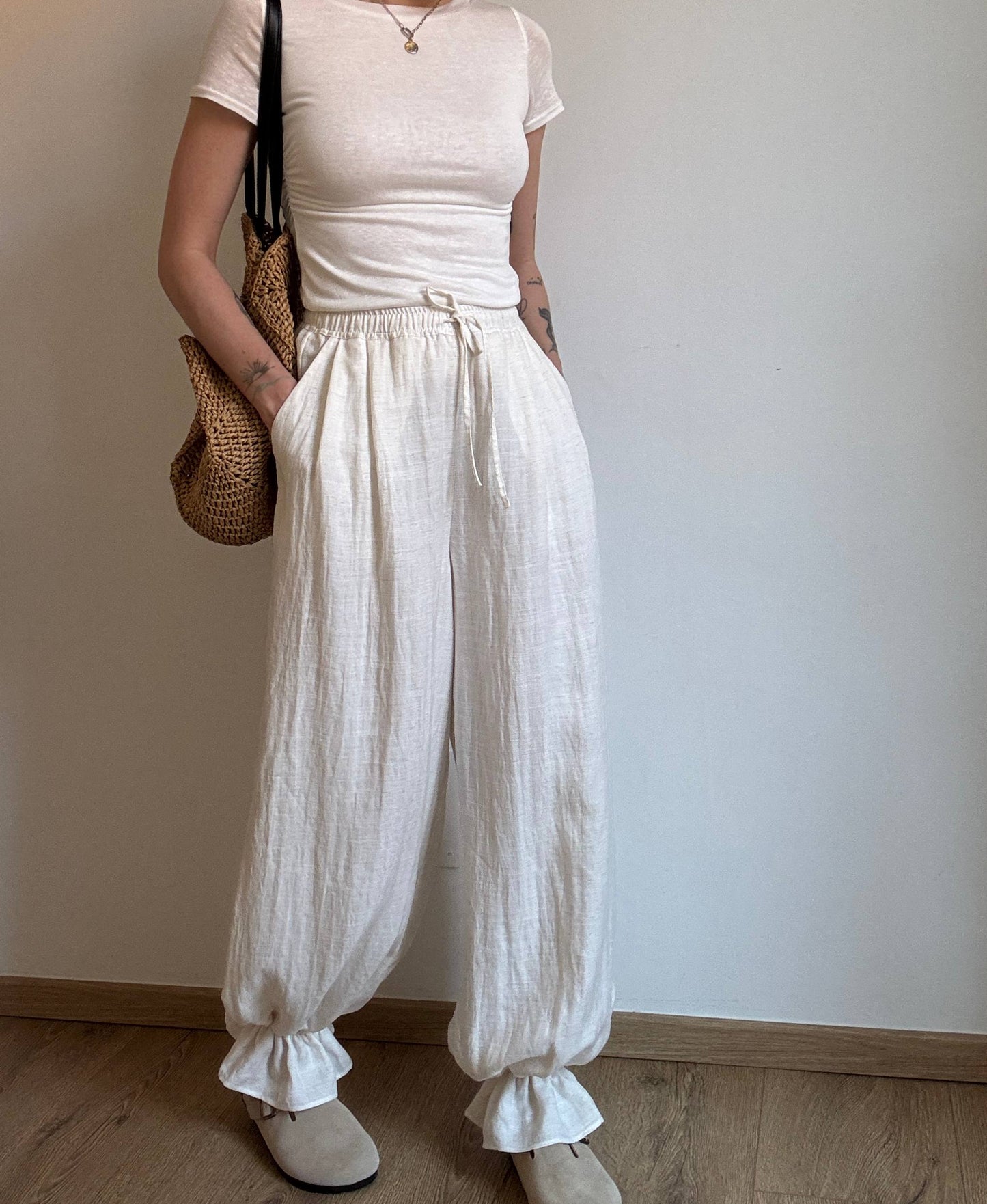 Natural trousers with ruffle detail