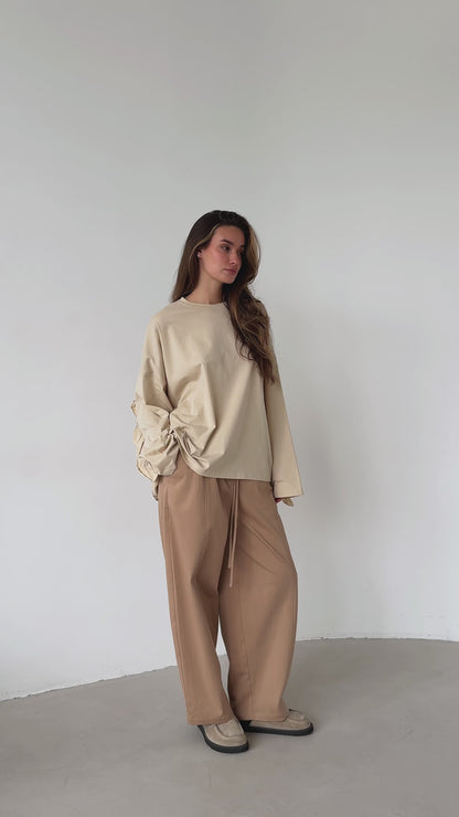 Beige open-back ruffle longsleeve